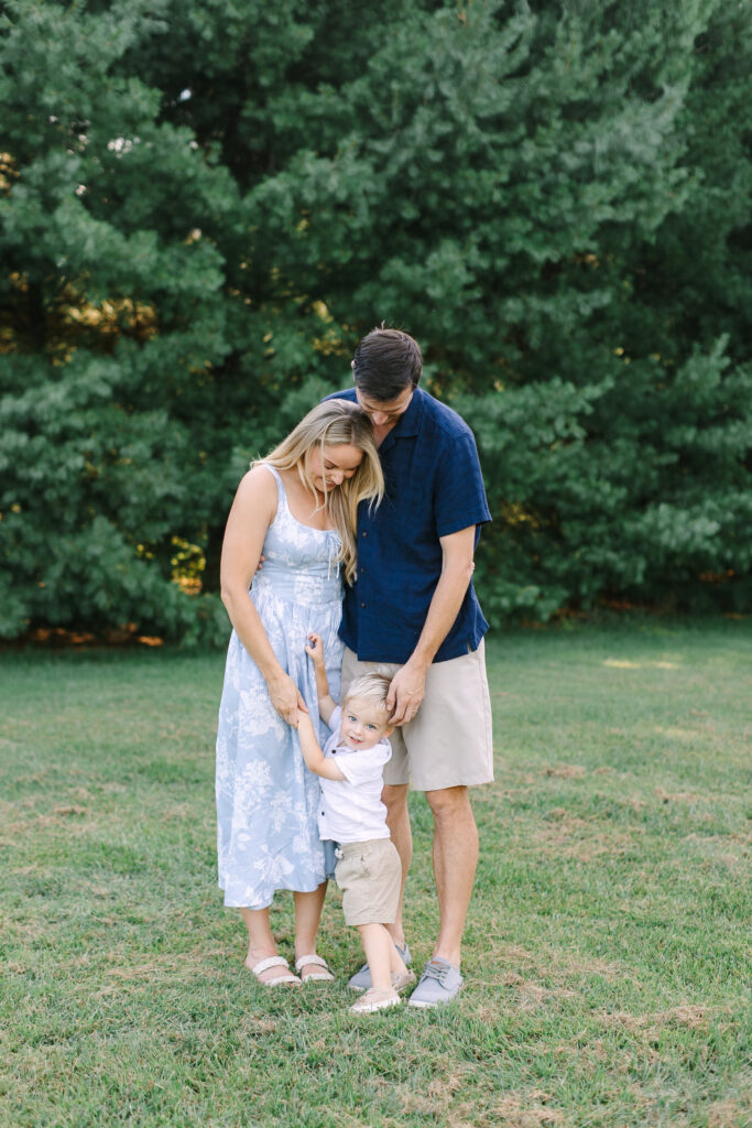 Candid family moment captured during a Michigan spring mini session with soft evening light