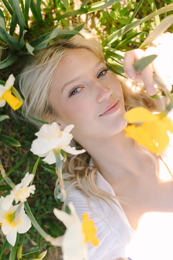 Spring senior session during Tulip Time with colorful tulip fields in Michigan