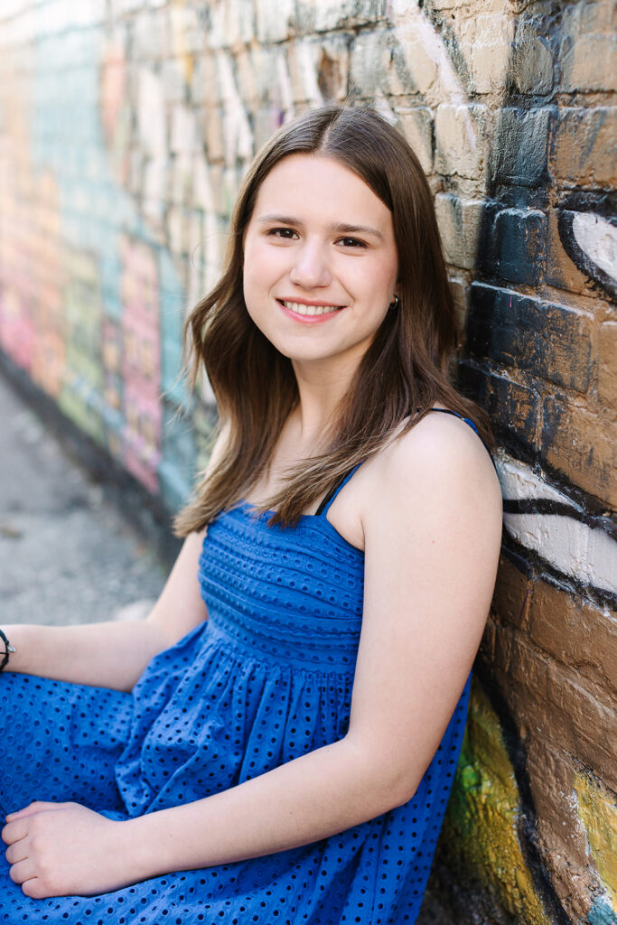 Artistic senior portraits with colorful graffiti walls in Michigan