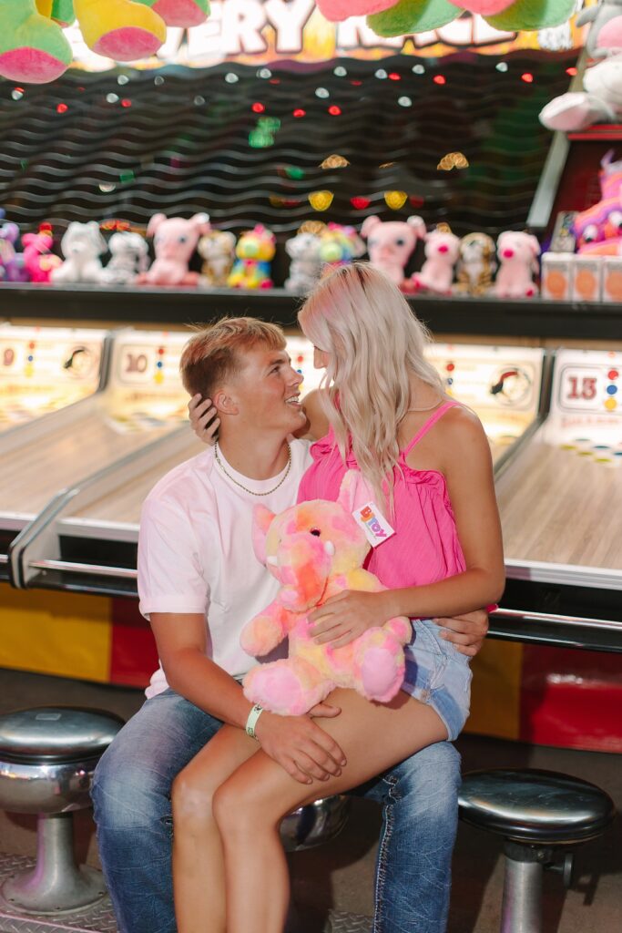 Cameron holding the stuffed elephant he won for Charlie during Senior Ambassador night at the Ionia Free Fair.