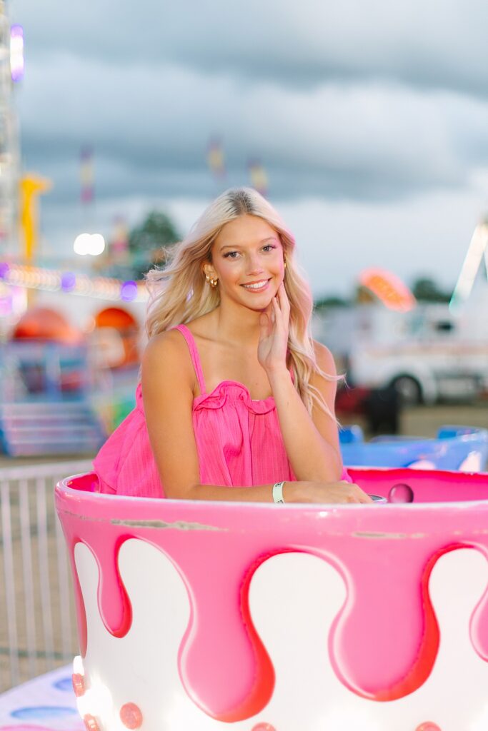 Senior Ambassadors laughing together on the teacup ride at the Ionia Free Fair.