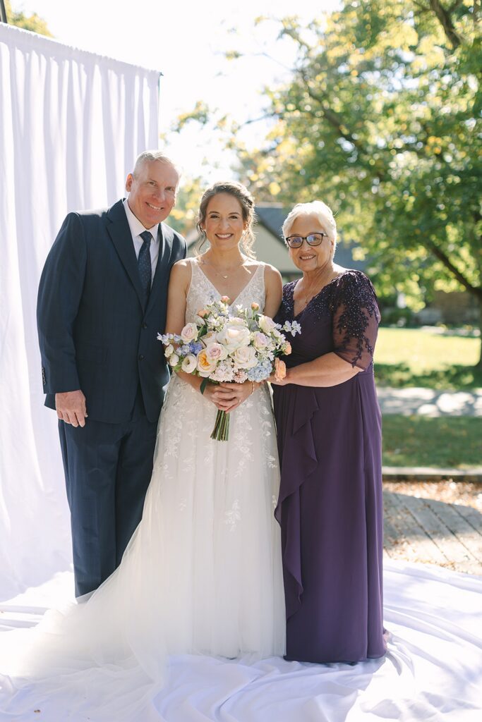 Aerin and Jack's wedding ceremony at Saint Thomas Aquinas and University Club of Michigan State in East Lansing