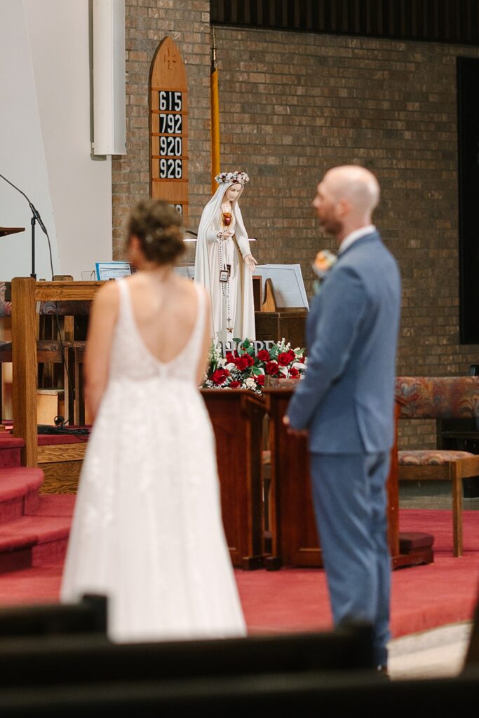 Aerin and Jack's wedding ceremony at Saint Thomas Aquinas in East Lansing