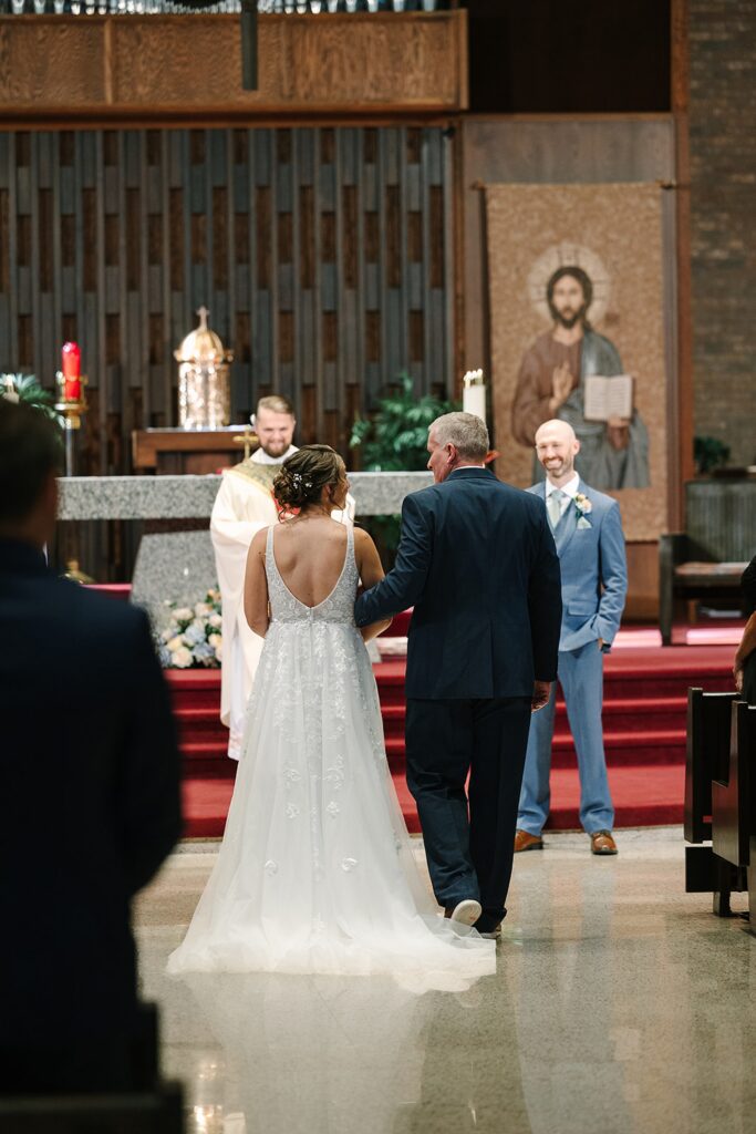 Aerin and Jack's wedding ceremony at Saint Thomas Aquinas in East Lansing