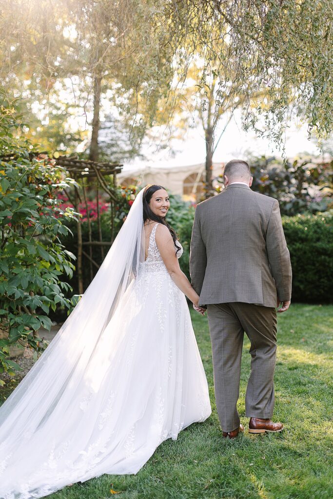 bride and groom walking during golden hour