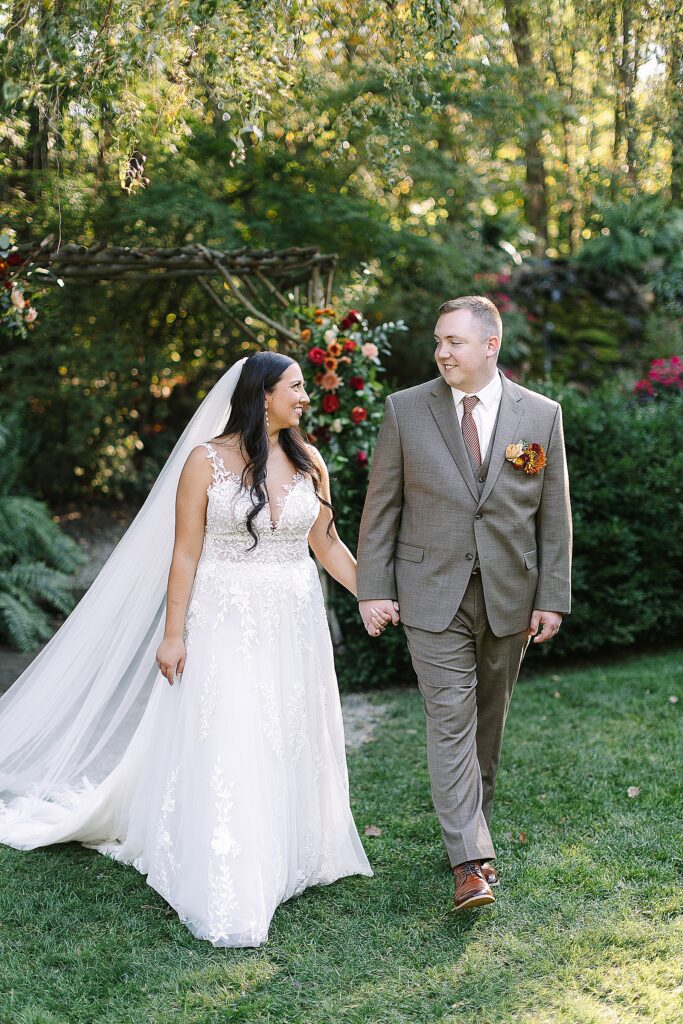 bride and groom walking during golden hour