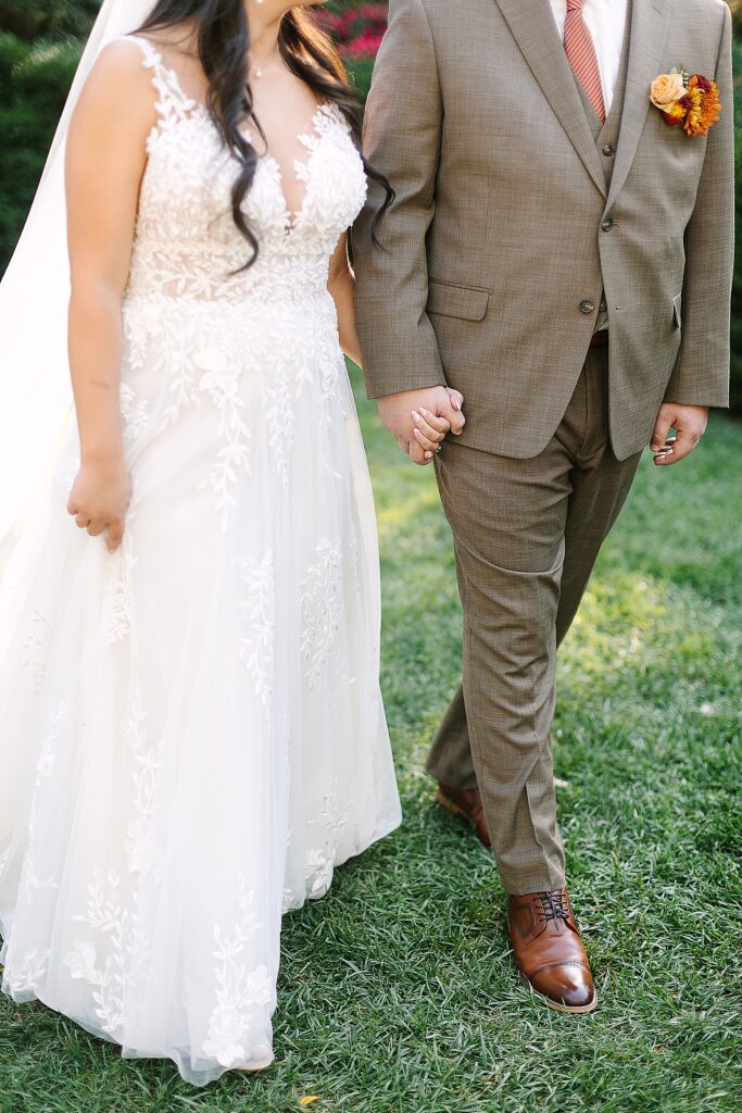 bride and groom walking during golden hour